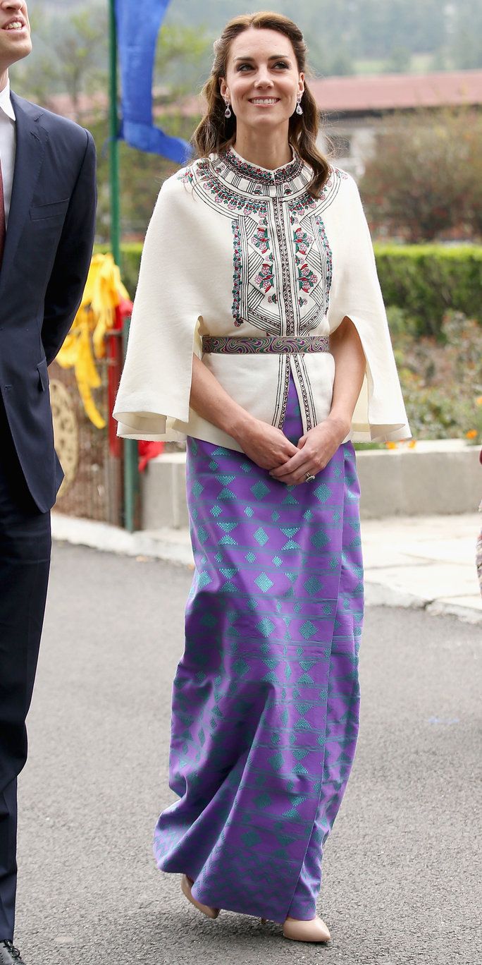 كاترين، Duchess of Cambridge walks with Prince William, Duke of Cambridge as part of a ceremonial Chipdrel on arrival into the Tashichhodzong (fortress) on the first day of a two day visit to Bhutan on the 14th April 2016 in Paro, Bhutan. The Royal cou