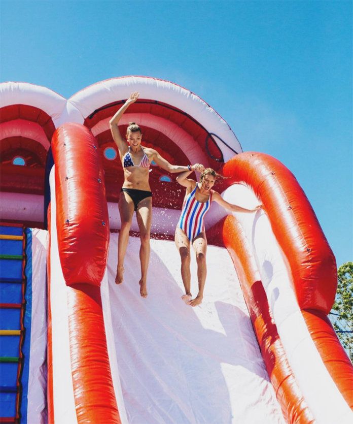 متى they took a joint leap of faith down a waterslide at Swift's Fourth of July bash. 